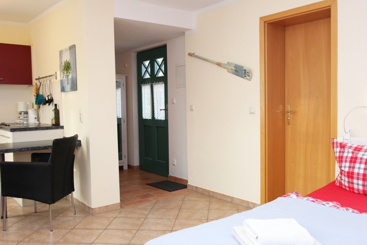 View towards the private entrance with its green door